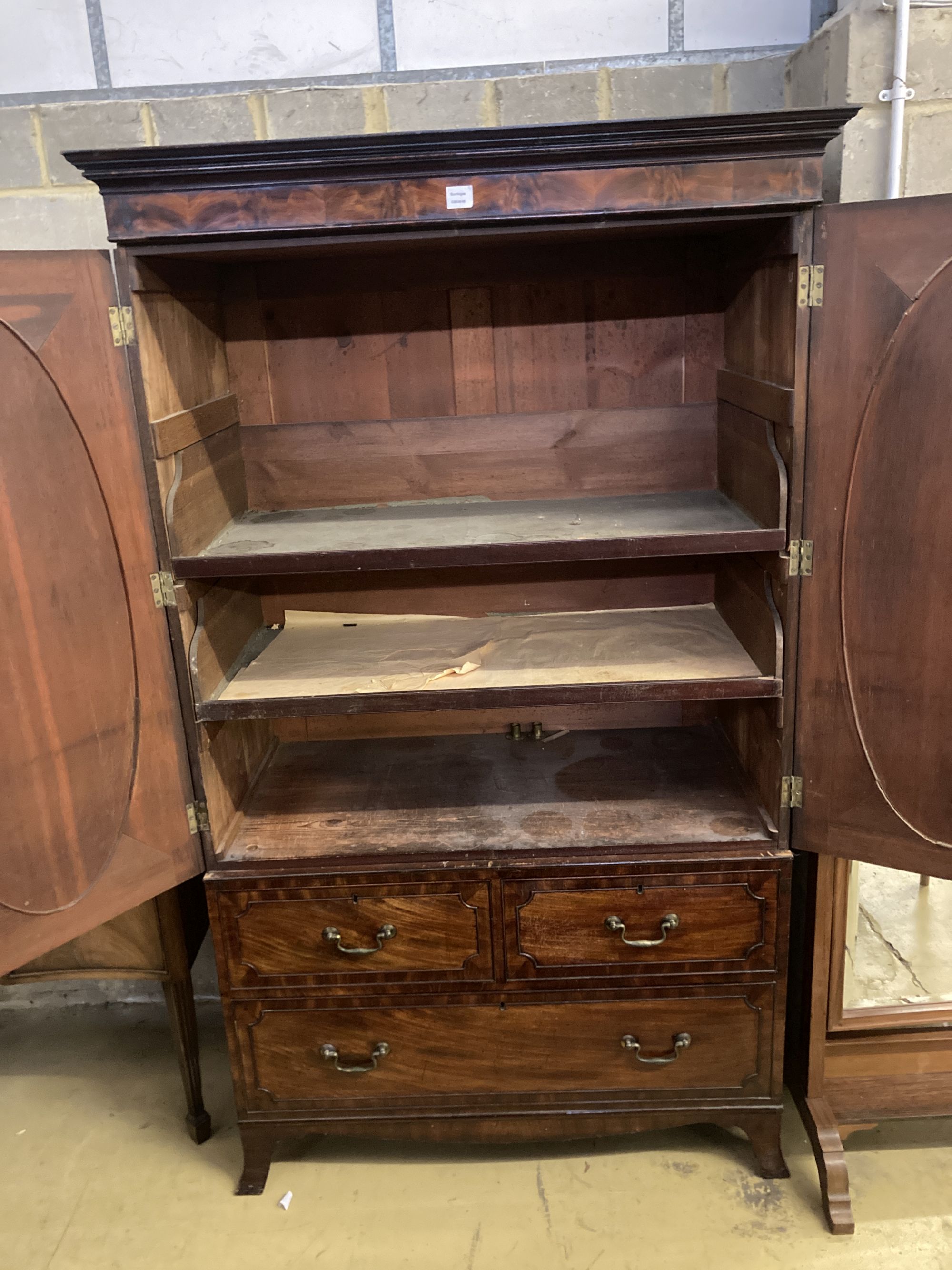 A George III mahogany linen press, width 120cm, depth 65cm, height 203cm